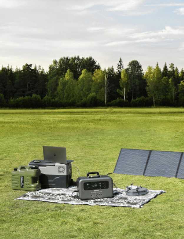 generator on a blanket next to appliances and a solar panel.