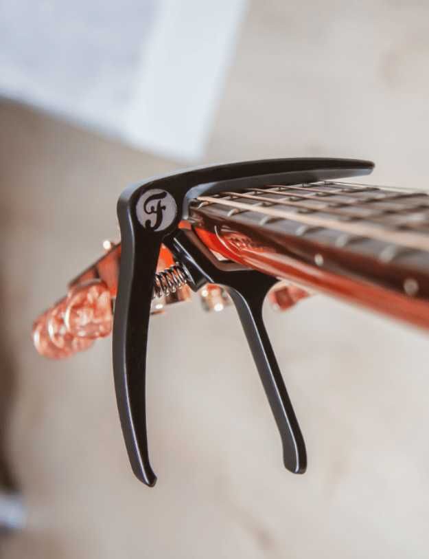 A capo on someones guitar.