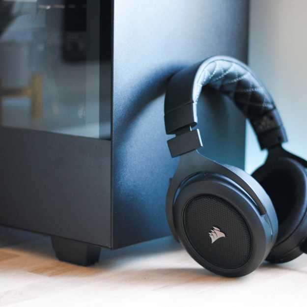 A headset leaning against a PC.