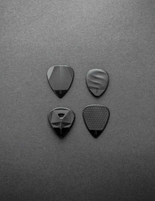 Guitar picks sorted by fours.