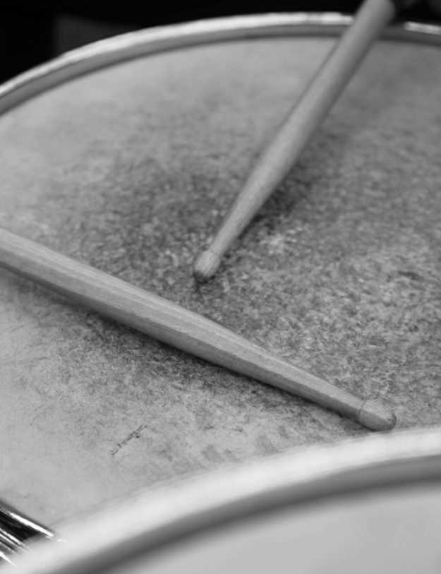 Black and white photo of a used snare drum.