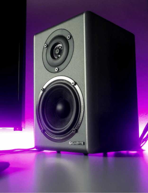 A Speaker with purple lights behind it.
