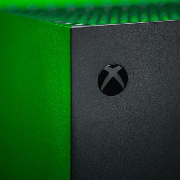 An Xbox in green light.