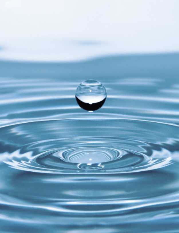 Close up of a water bouncing up on a body of water.