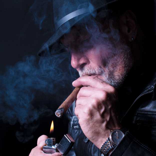 older man smoking a cigar