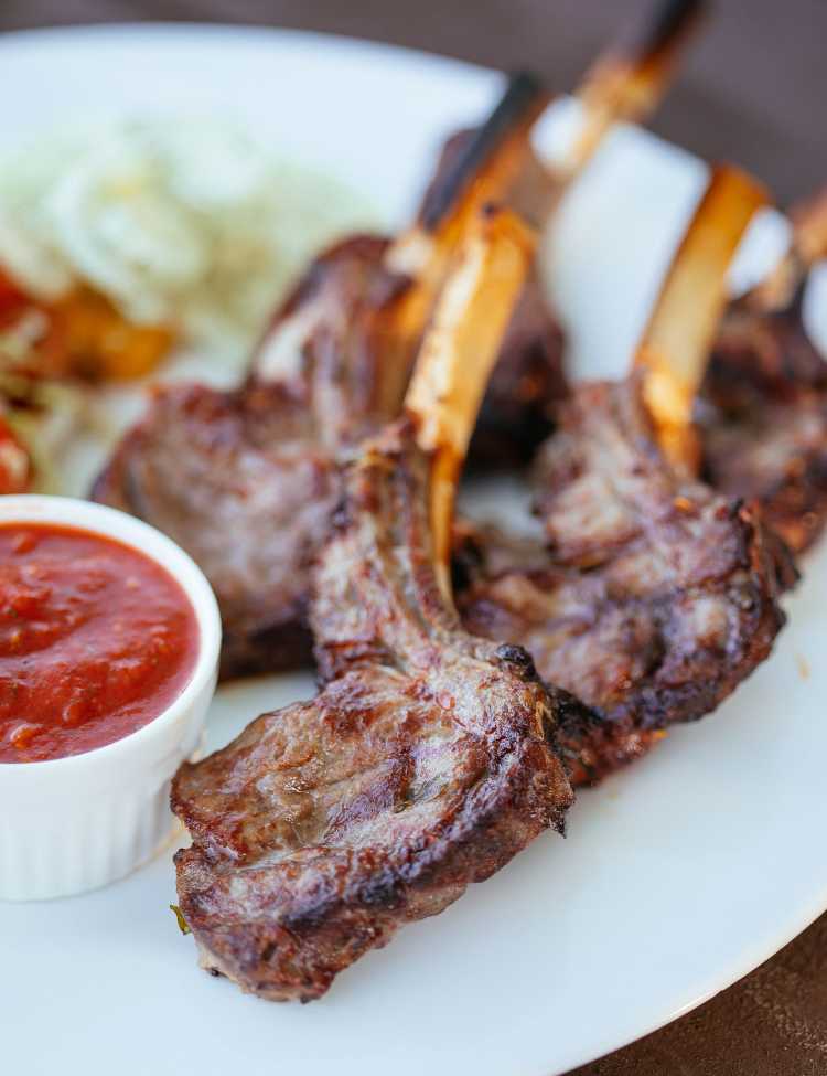 Lambchops all plated up with a side of sauce!