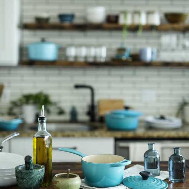 A kitchen with many dishes.