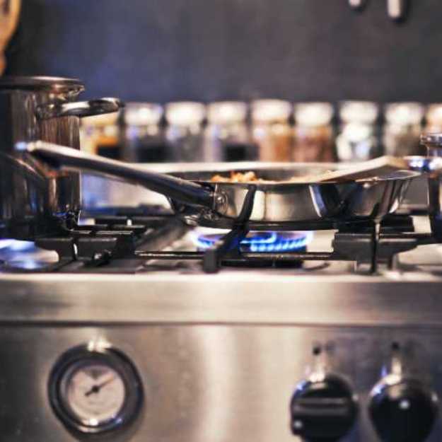 A Stainless steel cooking ware on a stove.
