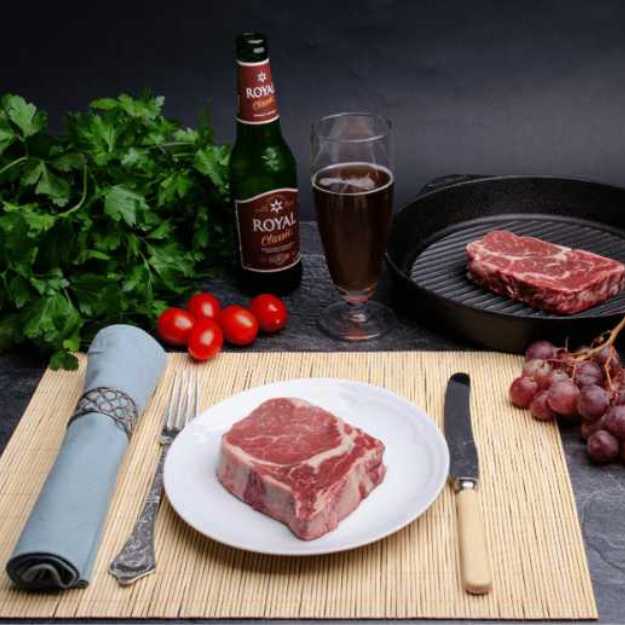 A Dinning set with raw steaks.
