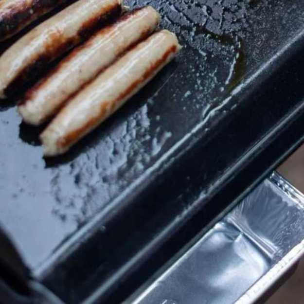 Sausages on a griddle.