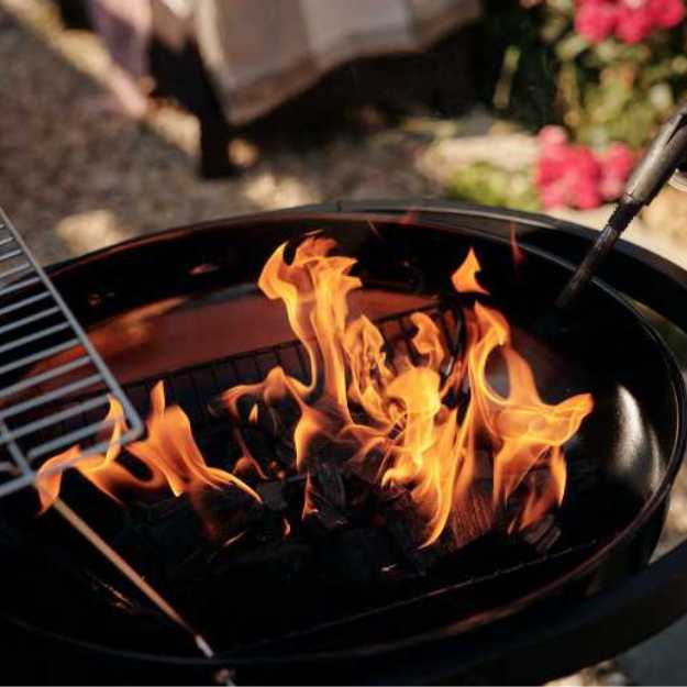 Burning charcoal in a grill.
