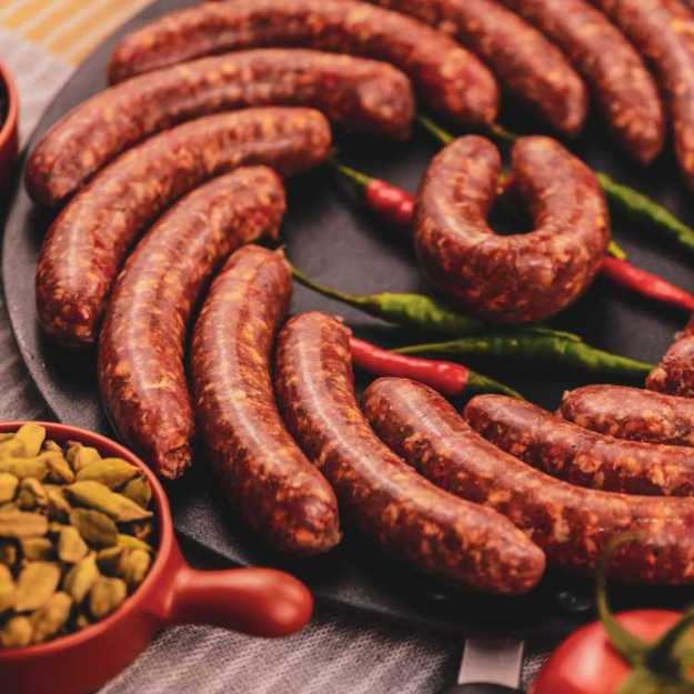 Brats laid in an circle on a plate.