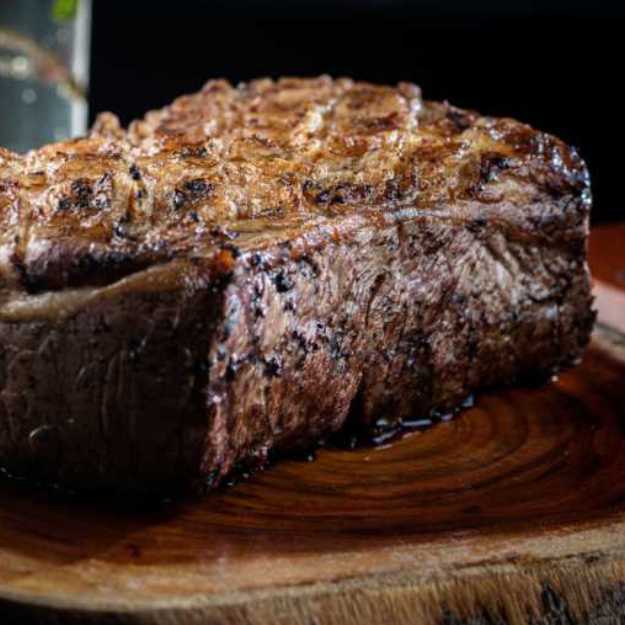 A Steak on a cutting board.