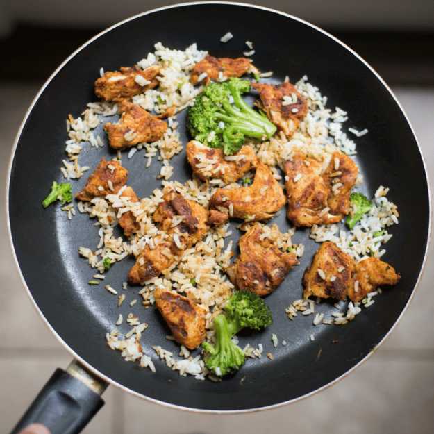 Chicken, broccoli, and rice in a pan.