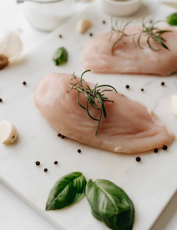 Raw chicken breasts, getting ready to be cooked on a pellet grill!