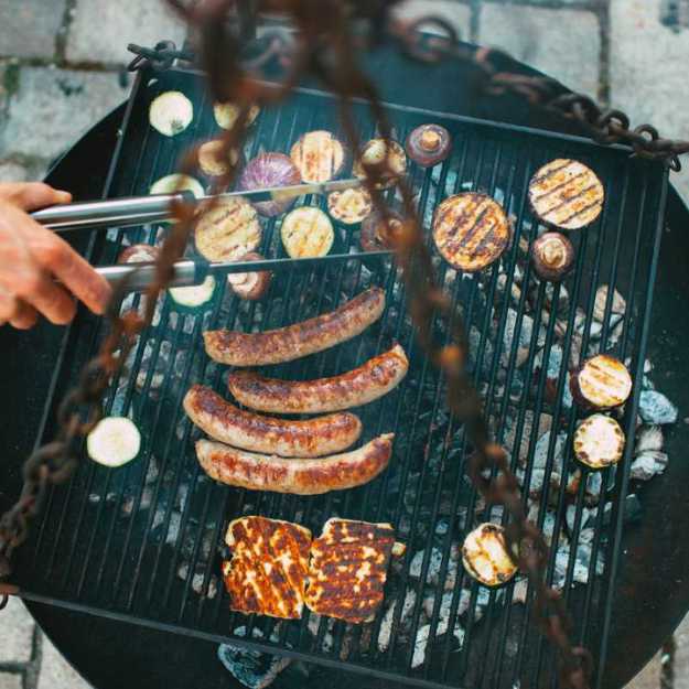 Various of foods on a hanging grill.