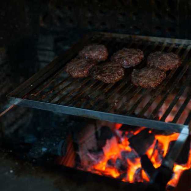 Burger patties on an grill.