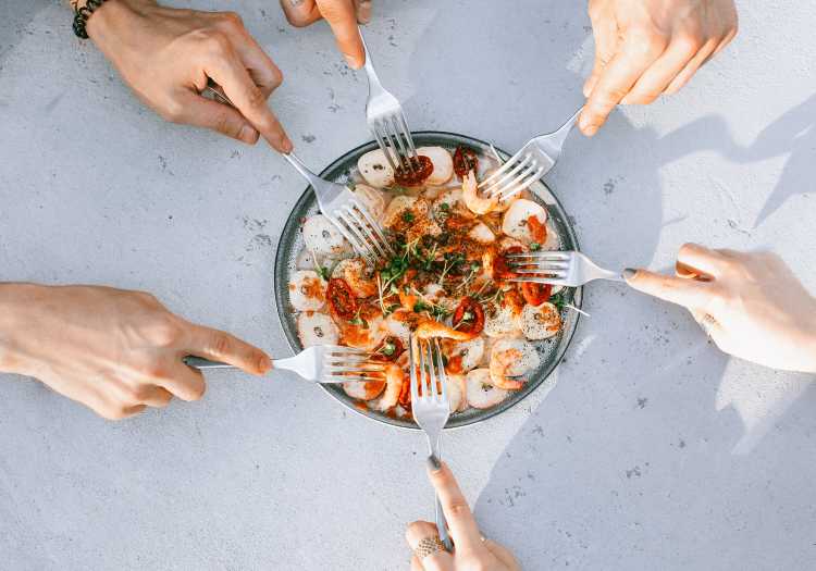 Serving your spicy grilled shrimp to your guests so they can enjoy!