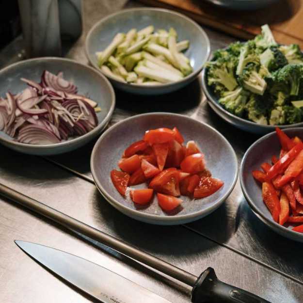 Plates of chopped veggies.