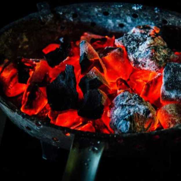 Heated coals in a pan.