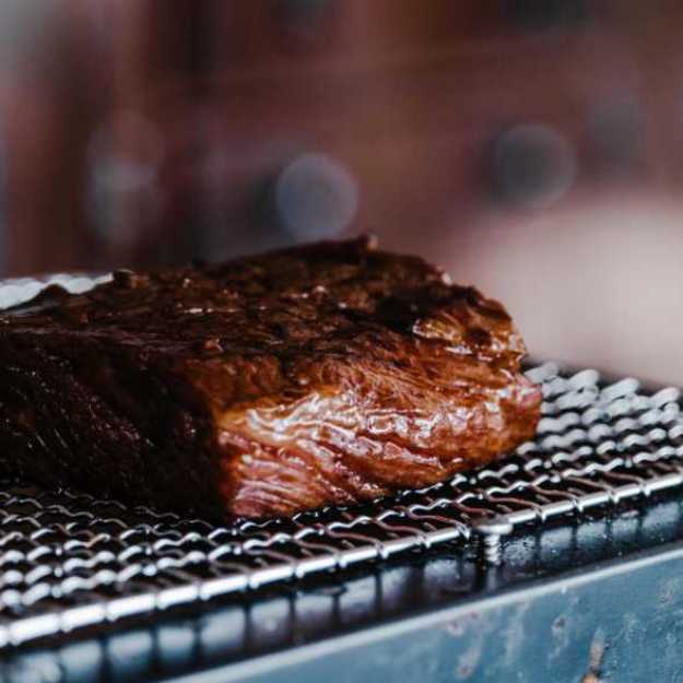 A Juicy steak on a drying rack.