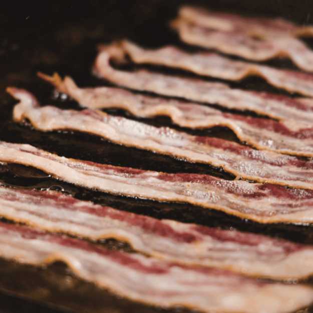 Bacon being cooked.