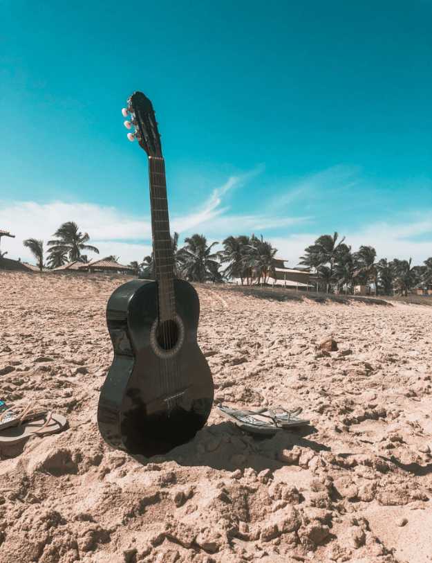 A Guitar On the sand.