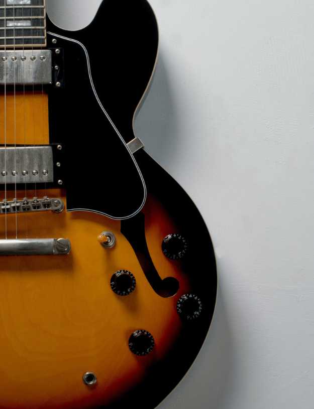 Close up of a jazz guitar.