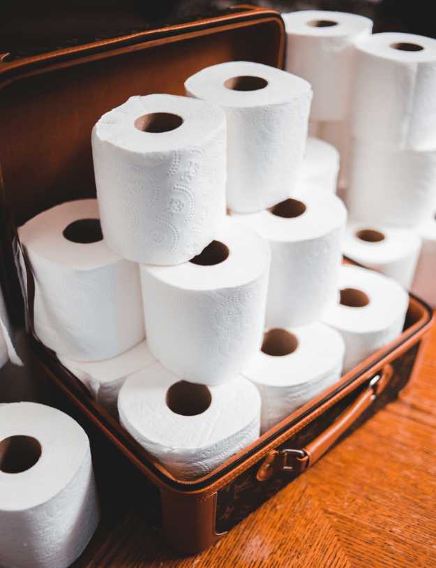 A Suitcase filled with toilet paper.