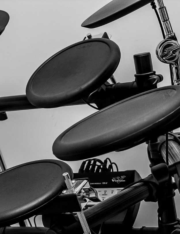 Side view of a electric drum set.