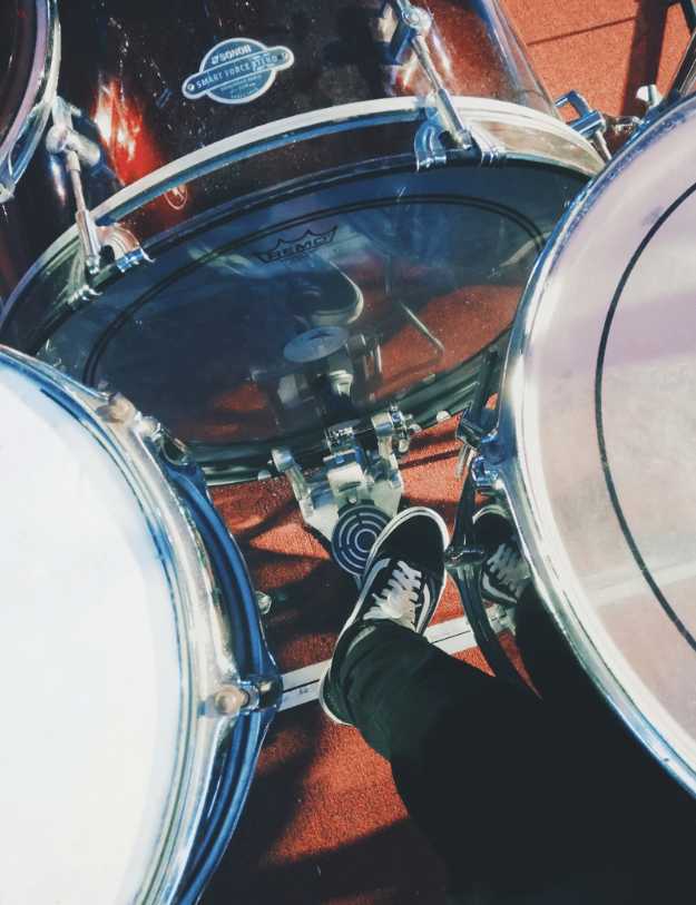Someones foot on a kick drum pedal.