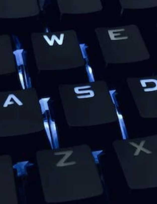 Close up of a keyboard with blue RGB.