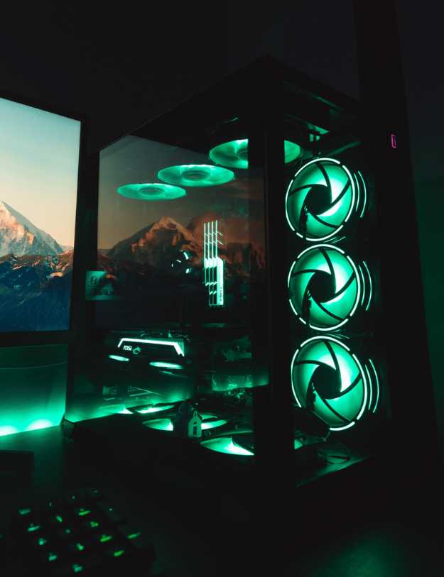 A glowing green PC in the dark.