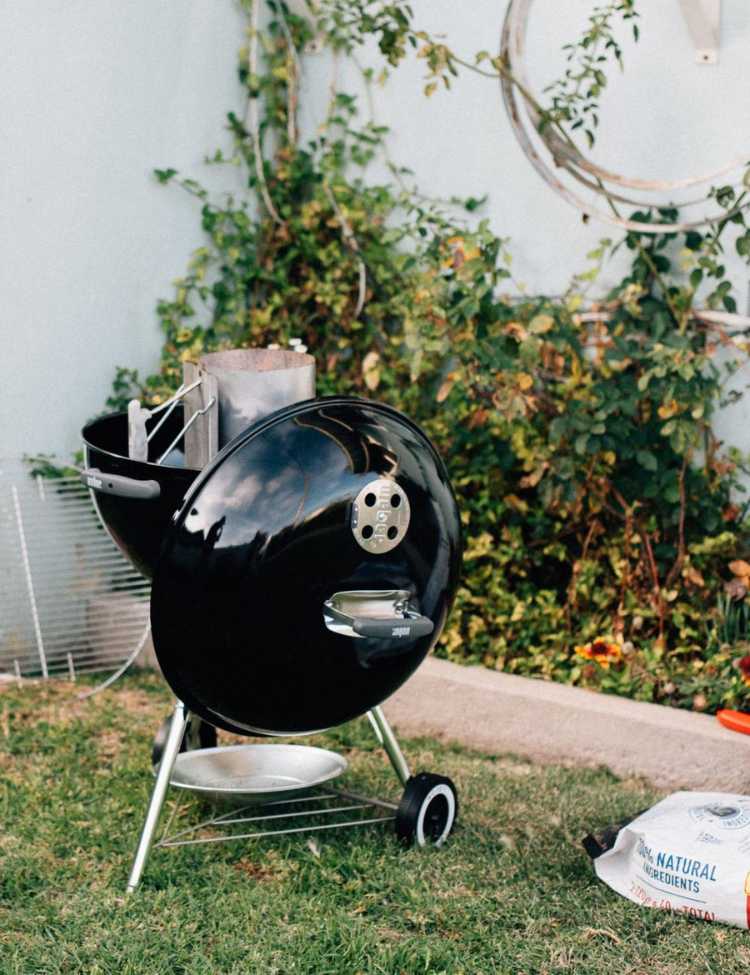 A Small outdoor grill being set up.